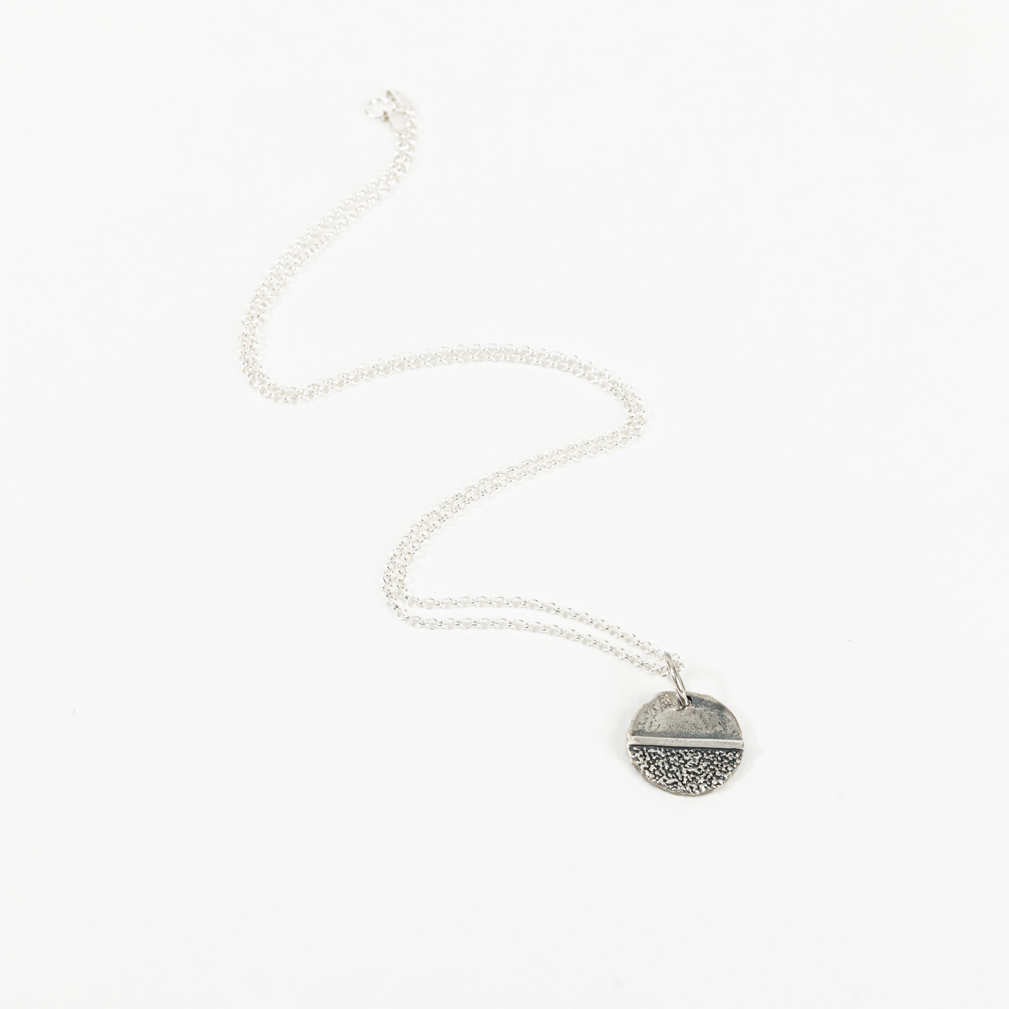 Small coin with jump ring and chain