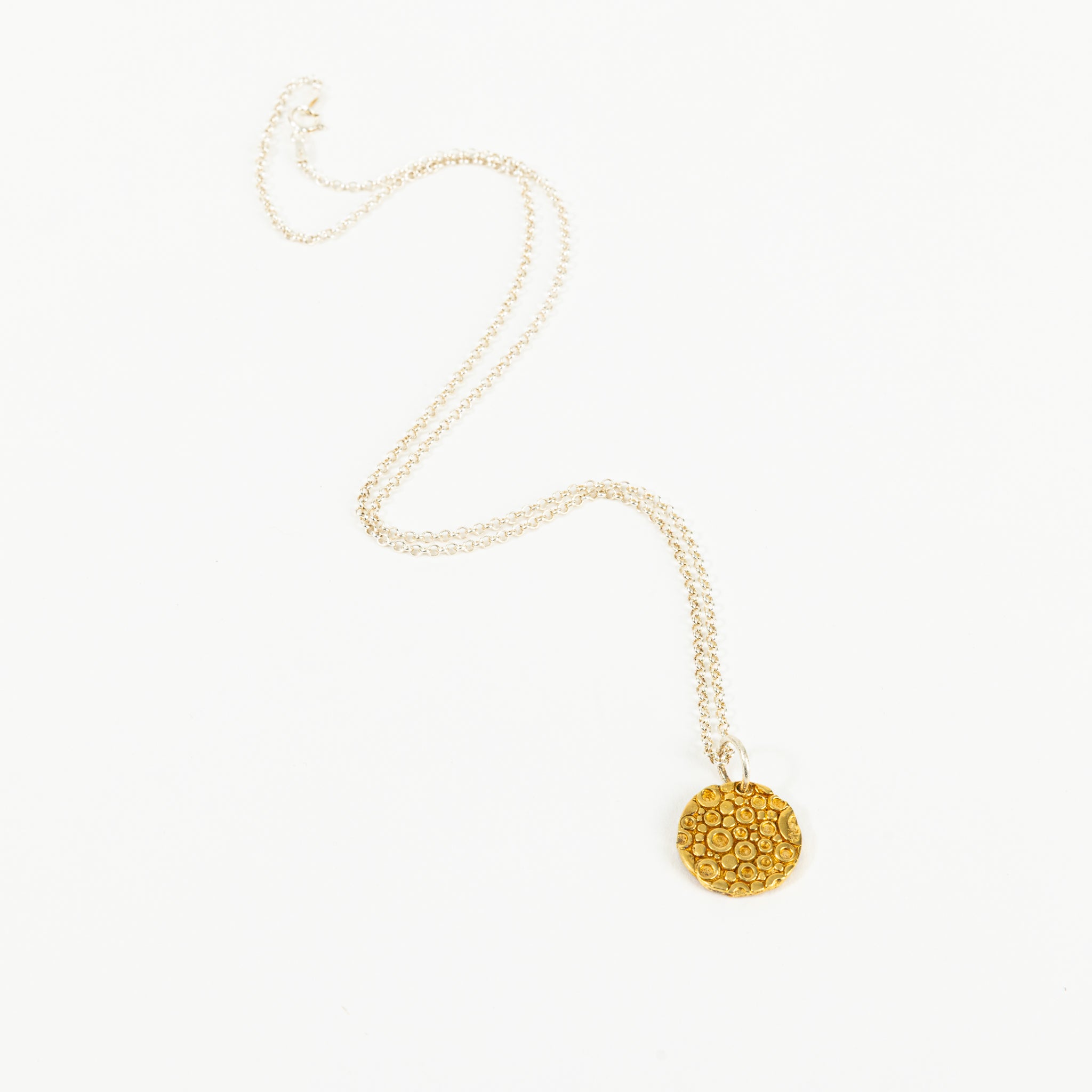 Small coin with jump ring and chain