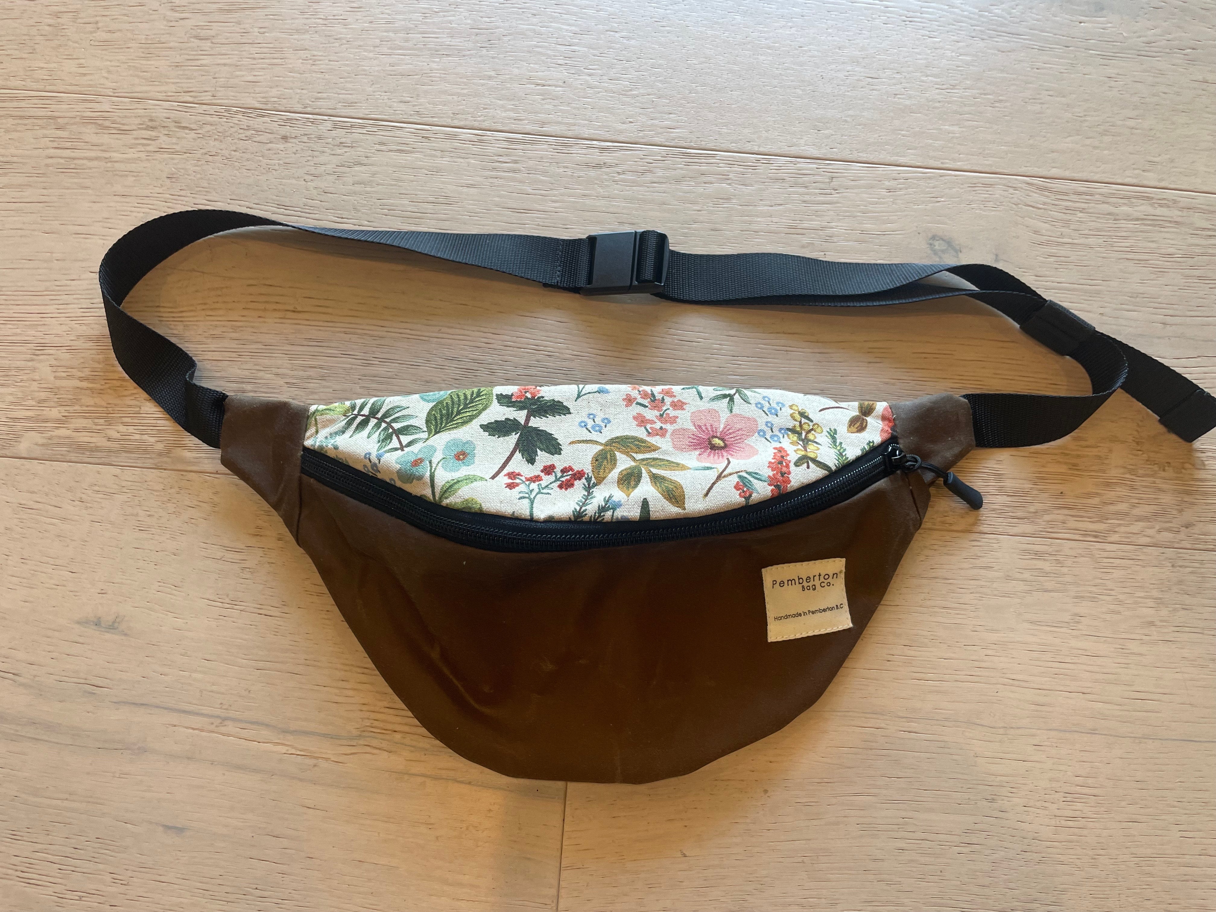 Brown oilskin fanny pack with white floral top