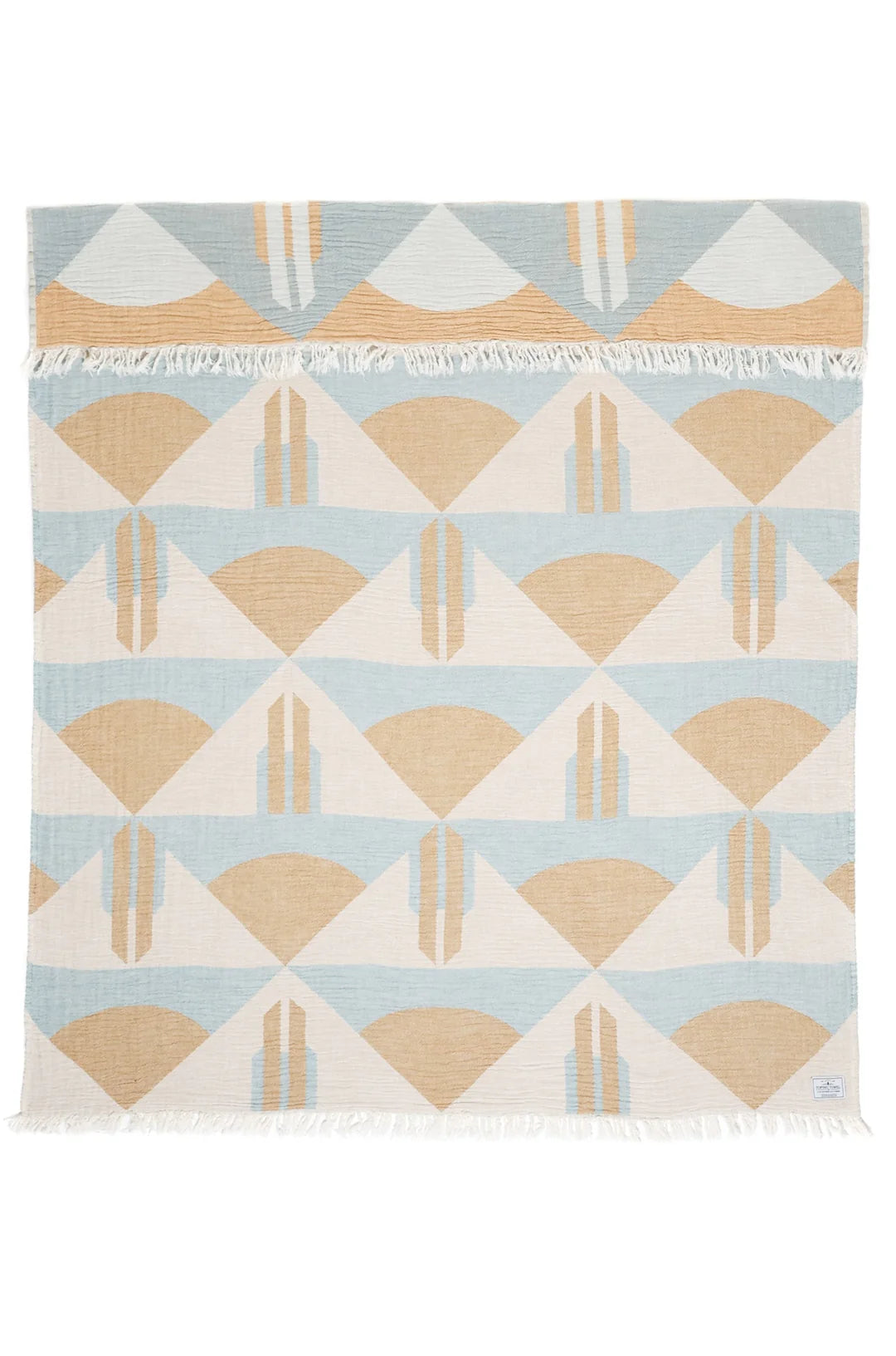 Geometric patterned rug with triangles on a light blue background