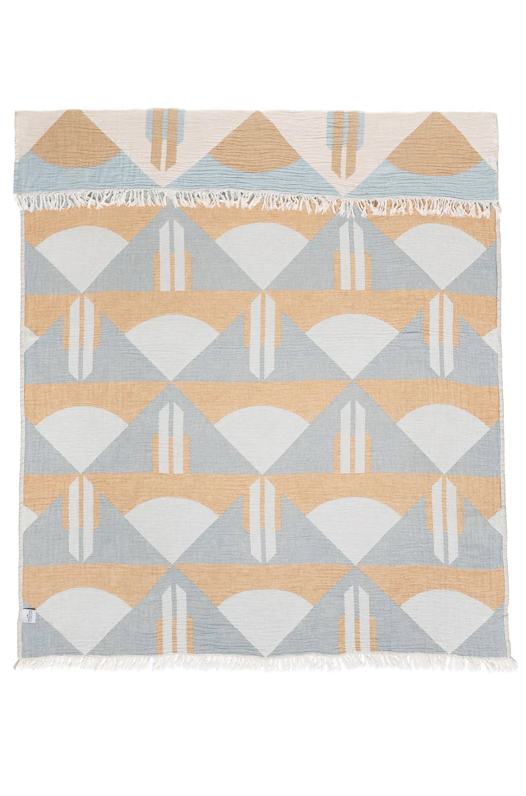Geometric patterned rug with triangles in beige, gray, and white on a white background