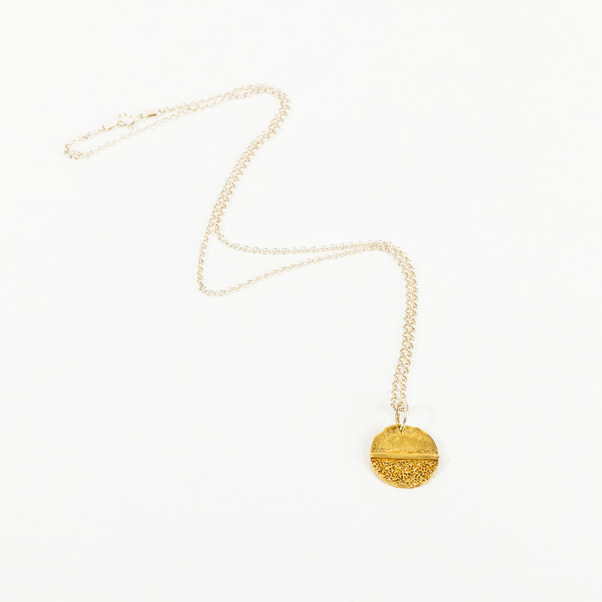 Small coin with jump ring and chain