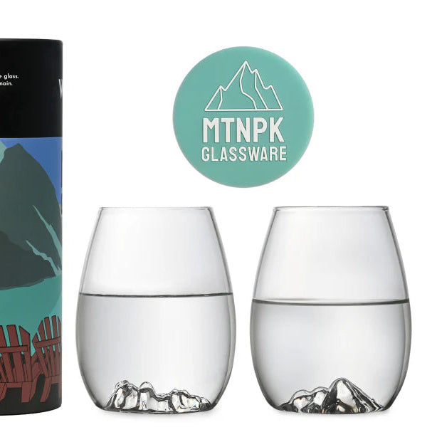 Wine set packaging with scenic designs and two glasses on a white background